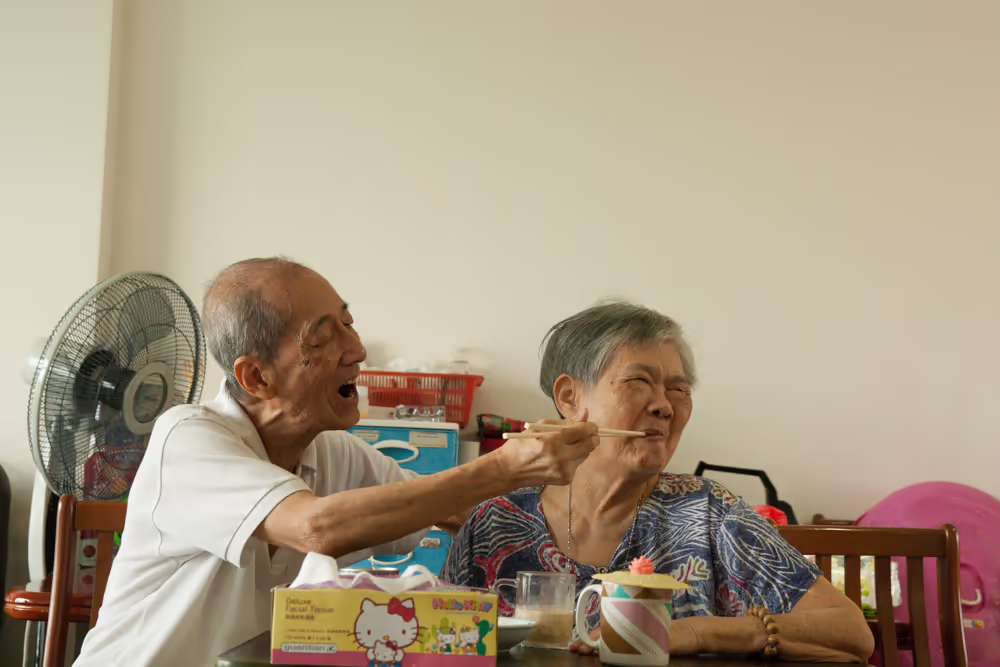 husband's love for wife with dementia in a hdb flat by singapore photographer Kelvin Lim
