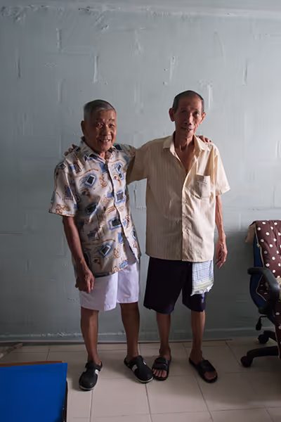 portrait of two friends in a hdb flat for hnf portraits of love by singapore photographer Kelvin Lim